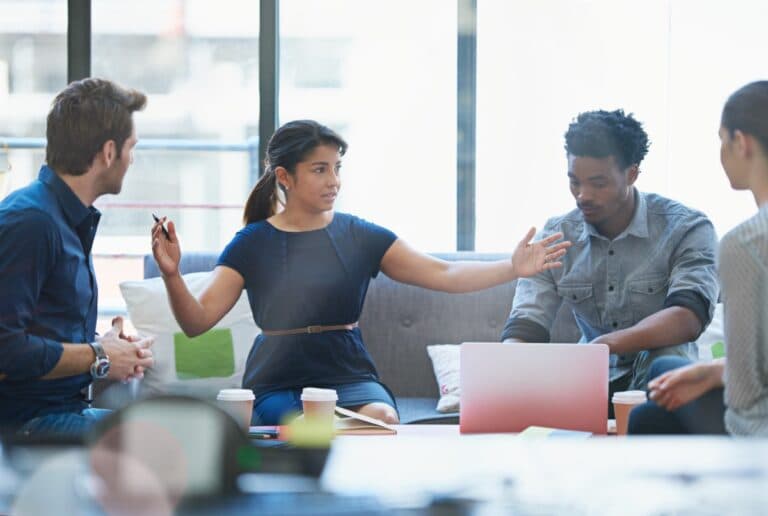 Project management team of four people working together