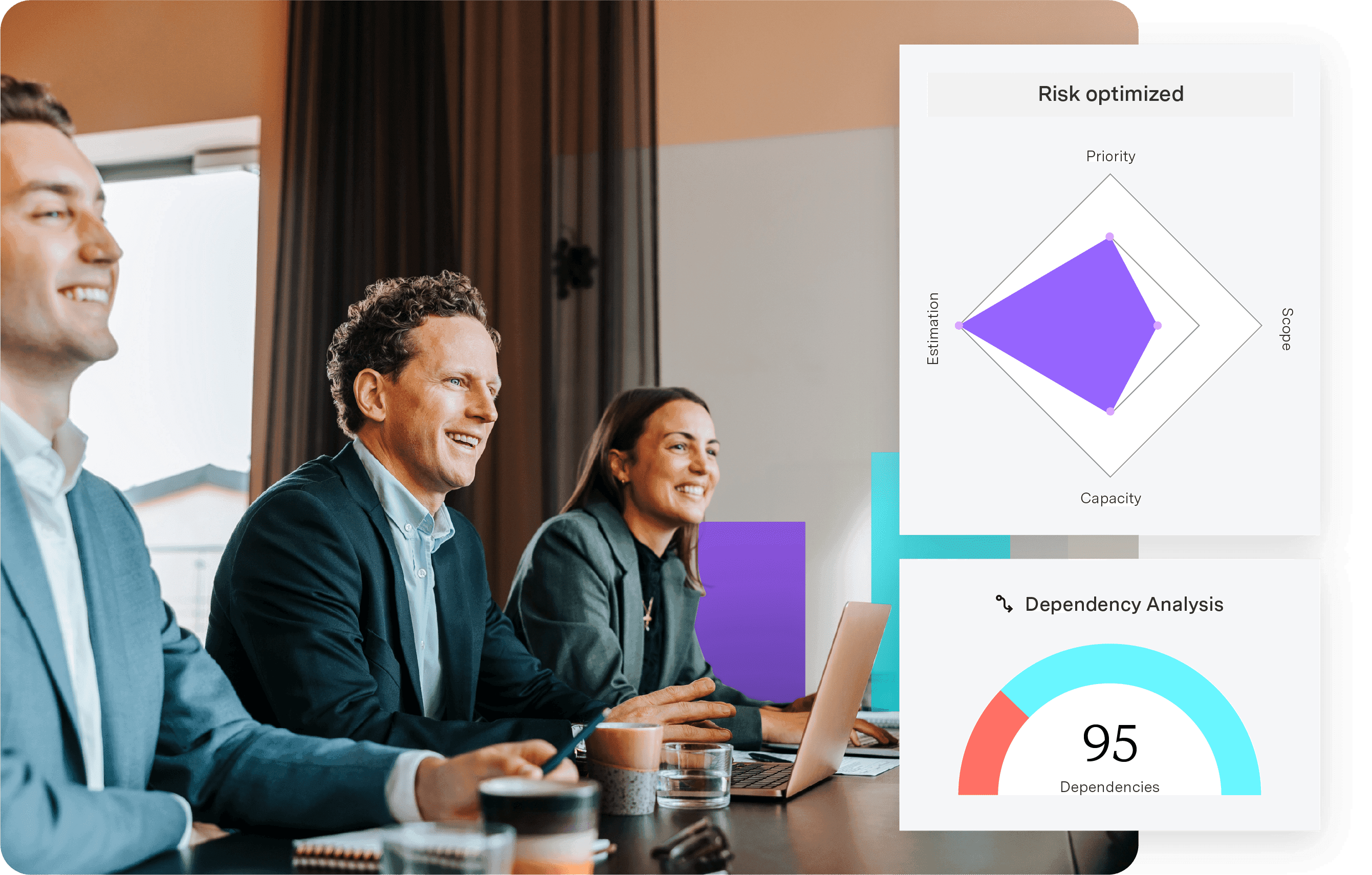 Group meeting seated at a table with laptops